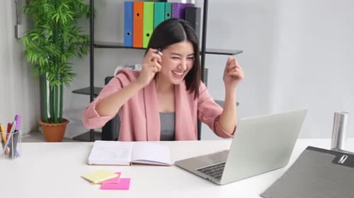 Young Asian business woman in office face portrait smile happy.