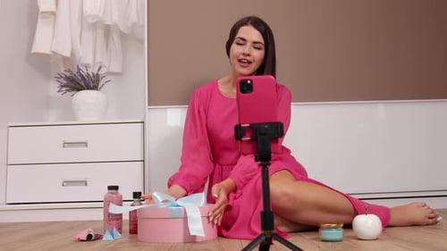 Woman Records Beauty Product Review at Home