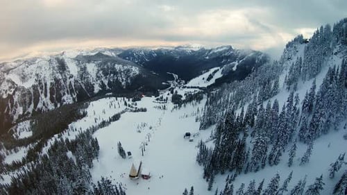 Aerial Pan Up Winter Recreational Sports Destination Mountain Resort