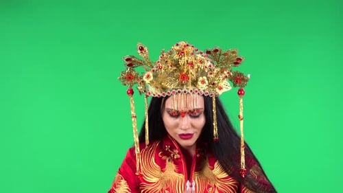 Woman with Elaborate Crown Bows on Green Screen