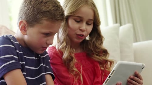 Children Using Tablet Together at Home