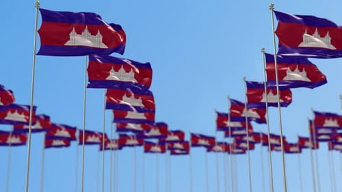 Waving Cambodian Flags on Flagpoles Against a Blue Sky