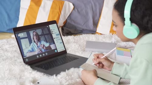 African Teen School Girl Distance Learning During Online Class with Teacher