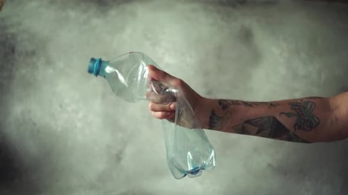 Hand Squeezing Plastic Water Bottle
