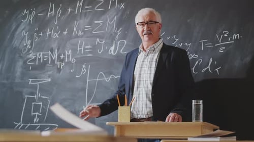 Senior Man Teaching Science in Classroom