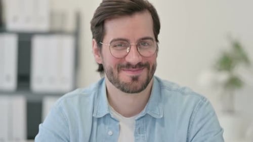 Smiling Young Adult Male with Glasses Close Up