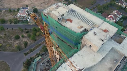 Aerial Shot of the Construction Site with One Onstruction Crane. Tall Building Construction Concept