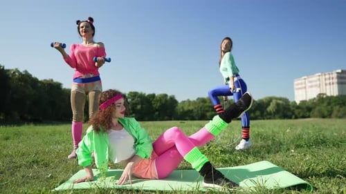 Women in 80s Outfits Work Out in Park