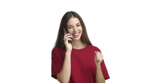 Woman Smiling and Talking on Mobile Phone