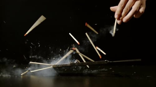 Mousetrap Snapping Shut on Burning Matches in Slow Motion