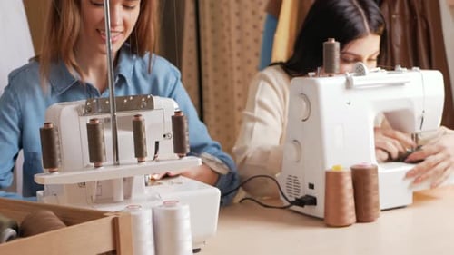 Young Women Sewing in a Fashion Workshop