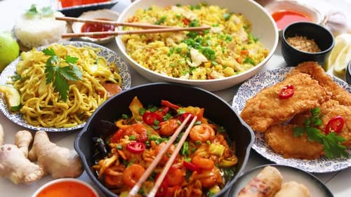 Delicious Asian Cuisine Selection with Noodles and Fried Rice