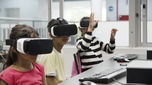 Children Use VR Headsets in Modern Classroom
