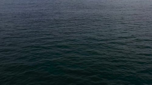 Seascape in the Early Morning. The Sea and the Island in the Distance.