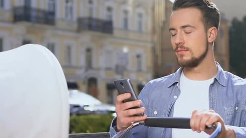 Excited Man With Baby Stroller Holding Smartphone, Shopping Online, Web Surfing