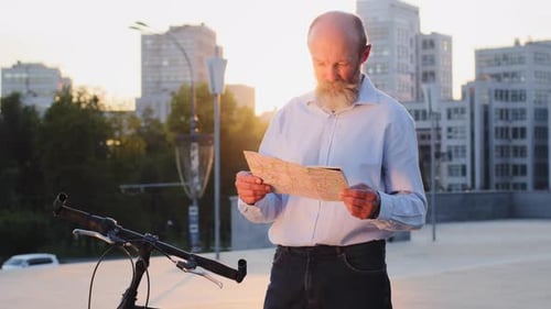Grandfather Male Tourist of Retirement Age Senior Man City Traveler Standing on Street Outdoors with