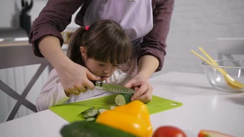 Mom Developing Motor Skills of Down Syndrome Child