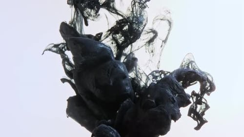 Abstract Black Ink Flowing in Liquid