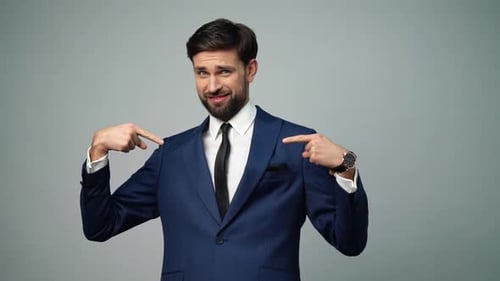 Confident Man Gesturing Thumbs Up in a Suit