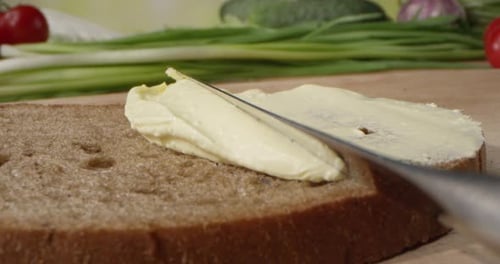 Spreading Butter on Bread Close Up