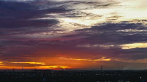 Brilliant Sunset Over Cityscape Time Lapse