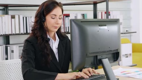 Business People Wearing Headset Working in Office