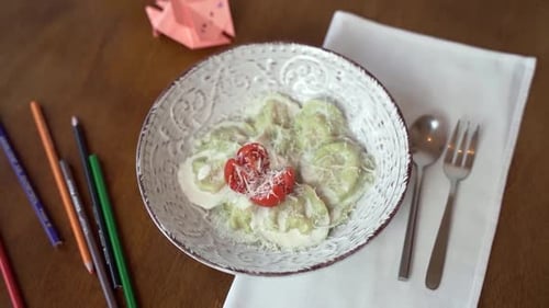 Overhead Shot of Ravioli with Tomatoes and Cheese