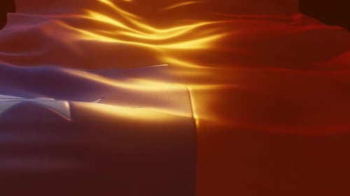 Luxurious Waving Fabric Background with Golden Shimmer Light