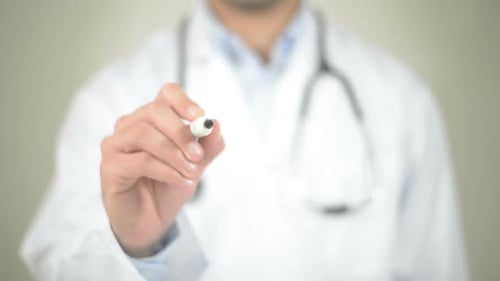 Doctor Writes "Patient" on Clear Surface