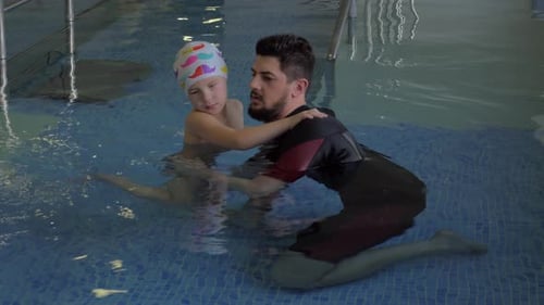 Child undergoing therapy in water