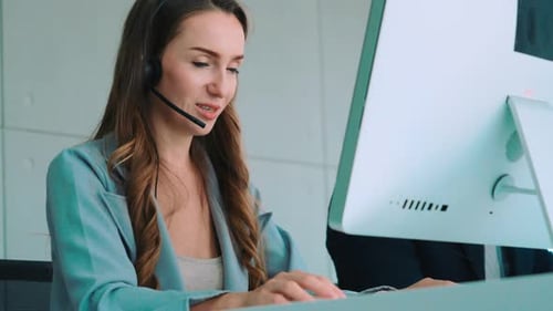 Business People Wearing Headset Working in Office