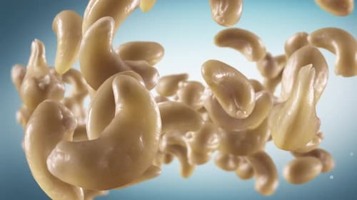 Rotating Group of Cashews Against Gradient Background