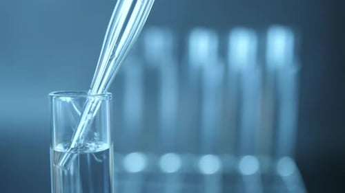 Liquid Being Added To Test Tube in Lab