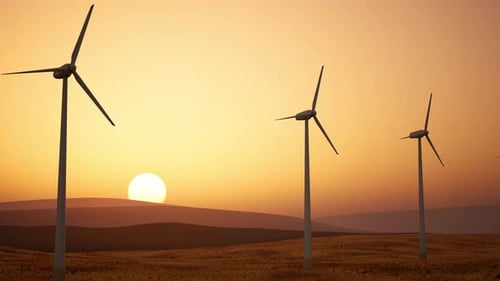 Wind Turbines Spinning at Golden Sunset for Renewable Energy