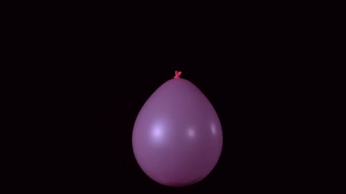 Pink Balloon Bursts in Dramatic Slow Motion