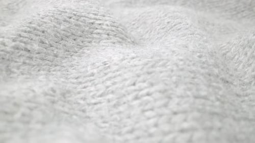 Extreme Detail View of Sheep Wool Cloth Texture Flowing in Macro Dolly Shot
