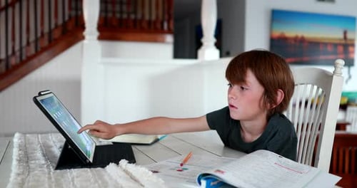 After his school closes down this young boy gets frustrated trying to learn online from home.