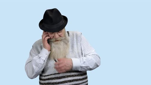 Aged Man Talking on Mobile Phone
