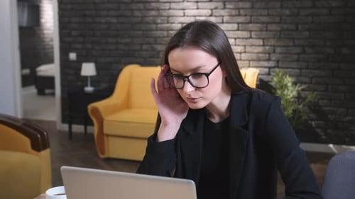 Professional Woman Working on Laptop at Home