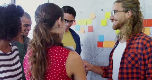 Creative Team Collaborating on Project in Modern Office