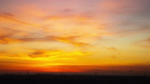 Sunrise cloudy sky time lapse on downtown cityscape building in the morning