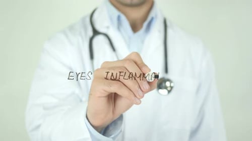 Eyes Inflammation, Doctor Writing on Transparent Screen
