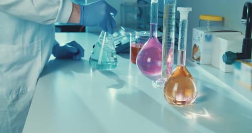 Laboratory Experiment Featuring Flasks and Cylinders