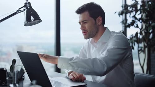 Businessman Having Video Call with Client in Office. Guy Getting Good News
