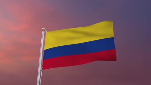 Waving Colombian Flag Against Vibrant Sunset Sky