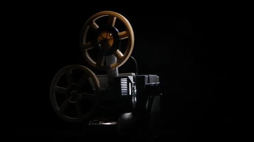 Projector Shows Film. Changing the Lighting in the Studio