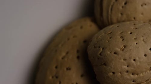 Cinematic, rotating shot of almonds on a white surface - ALMONDS 133