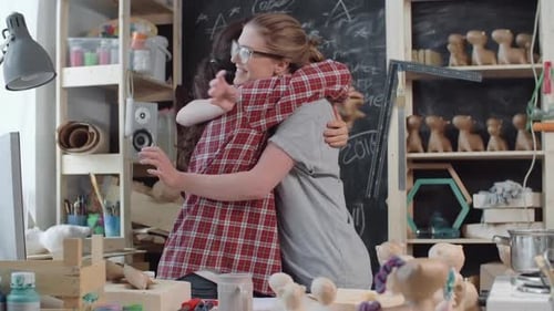 Female Artists Creating Clay Unicorn Sculpture in Studio