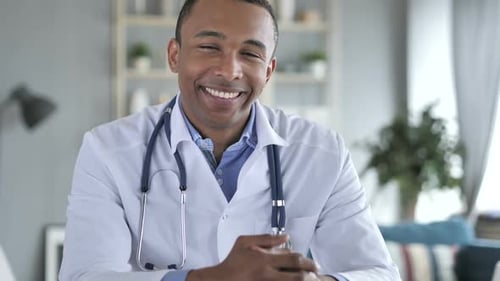 Smiling Doctor in White Coat with Stethoscope