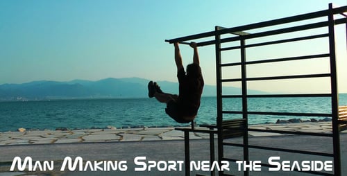Man Doing Abs Workout on Pull Up Bar by Ocean